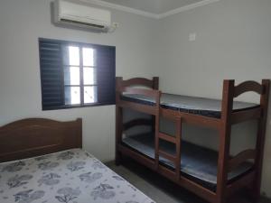 a room with two bunk beds and a bed at Casa mana in Olímpia +31 photos