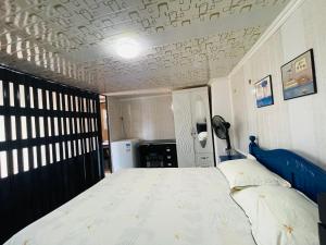 En eller flere senge i et værelse på Cozy House