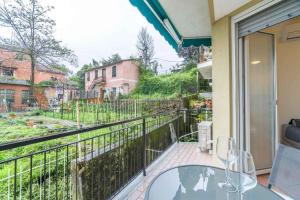 a balcony with a glass table and a view at Venus 3 by PortofinoVacanze in Rapallo