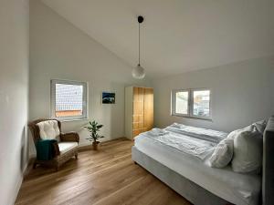 Postel nebo postele na pokoji v ubytování Staylight, Isernhagen Loft, Dachterrasse