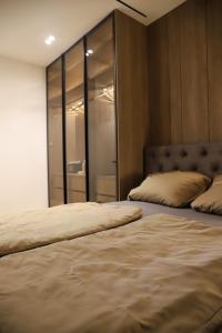 Ένα ή περισσότερα κρεβάτια σε δωμάτιο στο ModernApartmentsBL