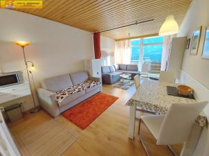 Istumisnurk majutusasutuses Apartment Grimmingblick