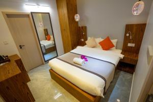 Ένα ή περισσότερα κρεβάτια σε δωμάτιο στο Hikers Villa - Fuvahmulah