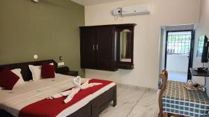 Postel nebo postele na pokoji v ubytování Divine Bliss Beach Resort