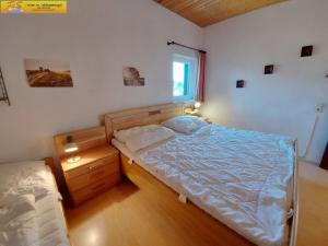 Postel nebo postele na pokoji v ubytování Apartment Grimmingsuite