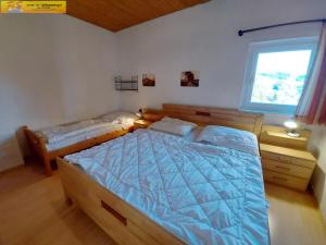 Apartment Grimmingsuite客房内的一张或多张床位