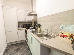 a kitchen with a sink and a counter top at North Segganwell - Culzean Castle in Maybole