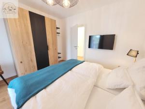 Rúm í herbergi á Penthouse Apartment Bergkristall