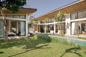 an external view of a house with a swimming pool at Villa Zara Spacious, Chic and Classy 2 Bedroom Home 5 minutes from Uluwatu Cliff Edge in Uluwatu