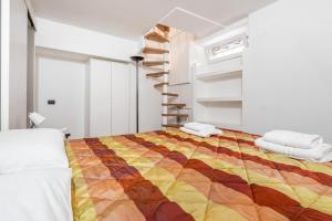 Postel nebo postele na pokoji v ubytování Brenta M3 Duplex Apartment