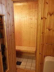 a wooden bathroom with a toilet in a room at Høyfjellshytte in Flå +25 photos
