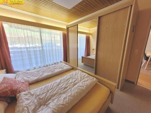 Postel nebo postele na pokoji v ubytování Apartment Almkogel