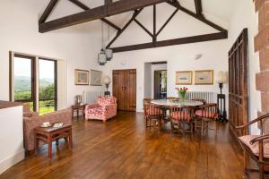 a living room with a table and chairs at Bank Barn, Wreay in Penrith