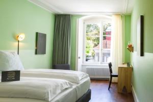 Postel nebo postele na pokoji v ubytování Hotel Schlüssel