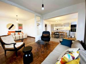 a living room with a couch and a table at 10 Courchamp in Courchamp