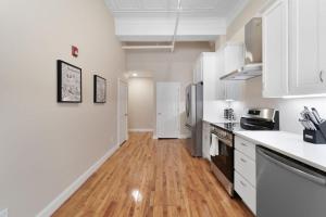 A kitchen or kitchenette at Hip Dtwn Apt With Arcade And Gym