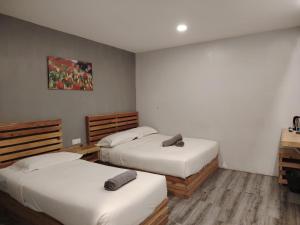 G9 Hotel Alor Setar客房内的一张或多张床位