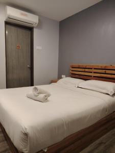G9 Hotel Alor Setar客房内的一张或多张床位