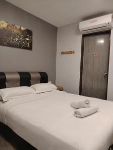 G9 Hotel Alor Setar客房内的一张或多张床位
