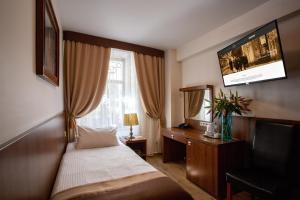 Rúm í herbergi á David Boutique Hotel