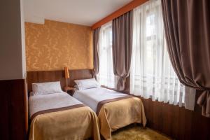 Rúm í herbergi á David Boutique Hotel