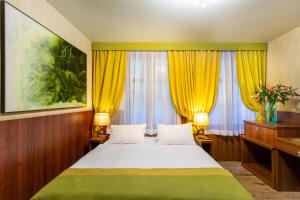 Rúm í herbergi á David Boutique Hotel