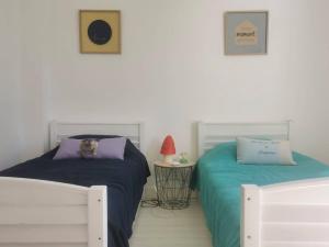 Posteľ alebo postele v izbe v ubytovaní Ti Laouen - maison cocooning vue mer
