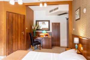 Rúm í herbergi á David Boutique Hotel
