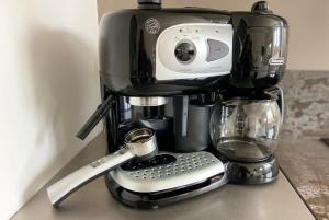 a coffee maker sitting on top of a counter at Saint-Pol family house garden fully equipped 12 people in Saint-Pol-de-Léon