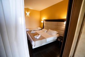 Postel nebo postele na pokoji v ubytování UNICO Cannamele Escape Tropea by Life Resorts