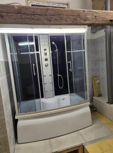 a large glass shower in a bathroom with at Rustikales Landhaus in Colmberg
