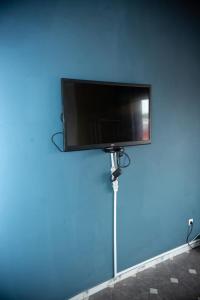 TV a/nebo společenská místnost v ubytování Xpress Location