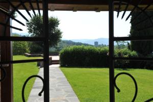 a view of a garden from a window of a house at Villa Montermoli Tuskany in Santa Maria