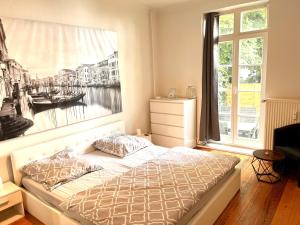 Postel nebo postele na pokoji v ubytování Doppelzimmer mit Terrasse in privatem Zuhause