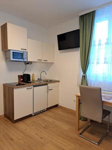 Kuchyň nebo kuchyňský kout v ubytování Private Zimmer HoAp