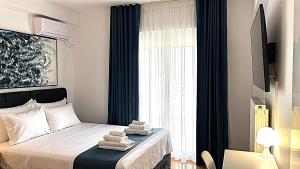 Postel nebo postele na pokoji v ubytování Athens Panoramic Penthouse