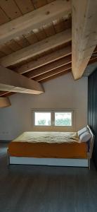 Ένα ή περισσότερα κρεβάτια σε δωμάτιο στο Casa nuova e spaziosa in centro