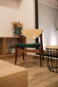 a table and a chair in a room at Casa Lomas in Oaxaca City +7 photos