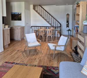 a living room with a table and chairs at MARTEL inLove in Martel