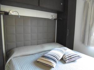 A bed or beds in a room at Camping Eden