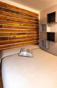 A bed or beds in a room at Camping Camplani