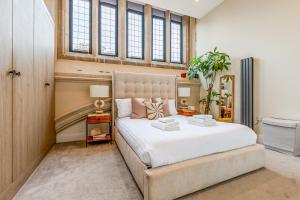 Ένα ή περισσότερα κρεβάτια σε δωμάτιο στο Gorgeous 2BR Flat in North Finchley, 3 min tube +26 φωτογραφίες