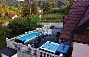 an overhead view of a balcony with a swimming pool at Panorama Apartman in Molvice