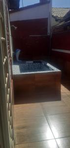 a wooden box with a keyboard inside of it at Chalé jane in Caldas Novas