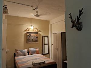 a bedroom with two beds and a chandelier at Cupid's Heaven Resort in Agonda +106 photos