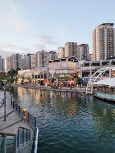 a river in a city with tall buildings at W House r077 in Gimpo