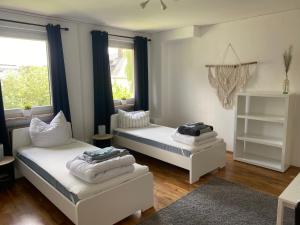 Postel nebo postele na pokoji v ubytování Apartmenthaus Selbitz