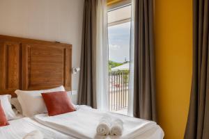 Postel nebo postele na pokoji v ubytování Hotel Elvezia