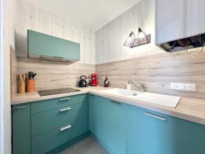 Køkken eller tekøkken på Grand appartement mer et commerces à pied