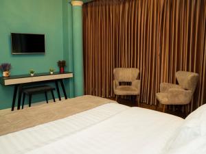 TV a/nebo společenská místnost v ubytování Hotel Vila Tirana